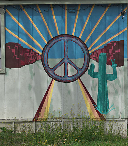 cactus and peace sign mural