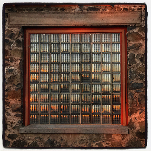 reflection in glass brick window